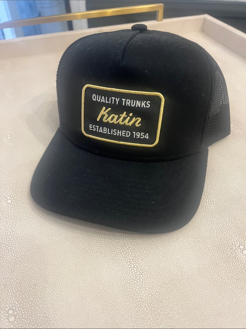 Katin Black Trucker Cap with Gold Patch